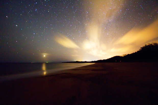 Jupiter rising and the lights from Bagara, Mon Repos beach at night.
