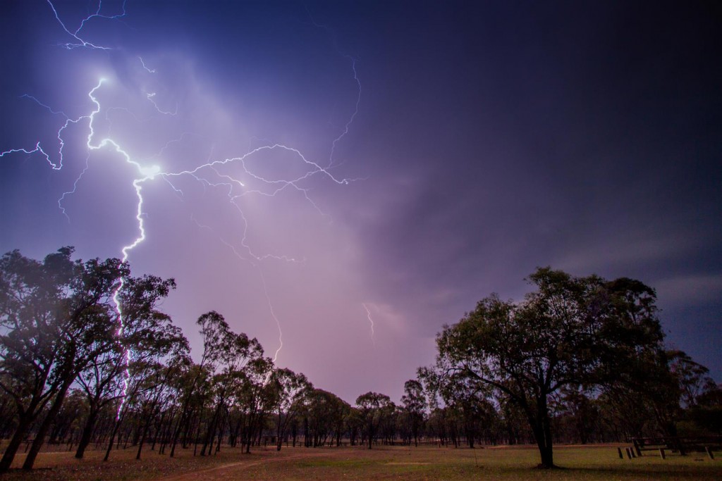 Lightning strikes the earth during a wild summer storm.